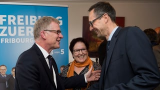 Jean-Pierre Siggen (san.) PCD, e Olivier Curty, PCD suenter lur elecziun en la regenza.