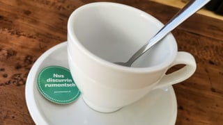 Il slogan dal café rumantsch – «Nus discurrin rumantsch»