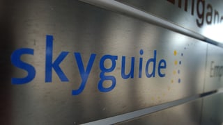 Purtret dal logo da Skyguide. 