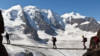 Alpinists sin la via al Piz Palü.