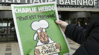 Il frontispizi da l'ultima ediziun da "Charlie Hebdo": "Tut è perdunà" – er Mohammed bragia per las victimas da l'attentat.