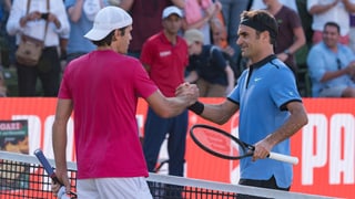 Purtret da Federer e Haas sin il plaz. 