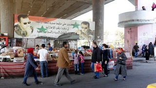 Persunas sin in martgà a Damascus, Siria.