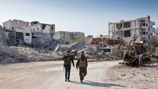Cumbattants da la milissa curda YPG en la citad Kobane en la Siria dal Nord.