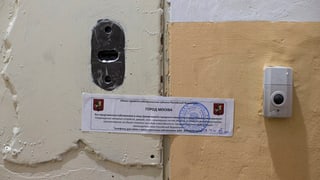 Purtret d'in isch cun davantvart in tatgader uffizial. 
