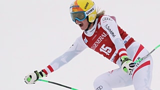 Hütter sin skis cun bucca tut averta.