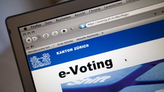 purtret d'in laptop, inscripziun e-voting.