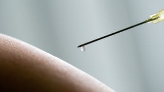 guila d'injecziun cun in pitschen dagut