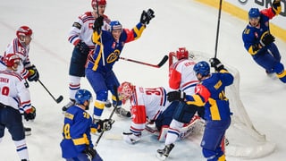 Giugaders da hockey han sajettà in gol e sa legran. 