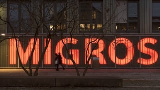 Purtret dal logo da la Migros. 