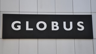Il logo dal Globus vi dal bajetg a Cuira.