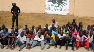 Migrants che spetgan en la Libia da pudair cuntinuar lur viadi.