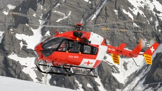 Purtret d'in helicopter da la Rega. 