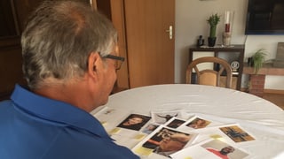 Um sesa a la maisa e guarda fotografias