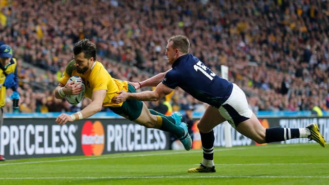Australia encunter Scozia al campiunadi mundial da rugby en l'Engalterra.