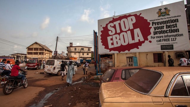 Placat cun «Stop Ebola».