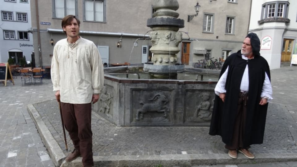 Il baptist Andreas Castelberger (Nicolas Zogg) e Johannes Comander (Joos Risch) da la vart dretga