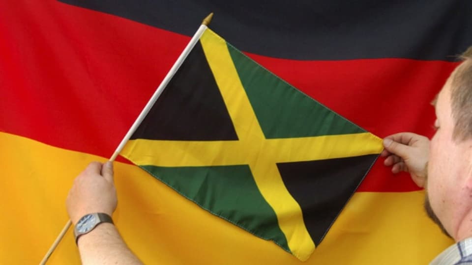 Las bandieras da la Germania e da la Giamaica.