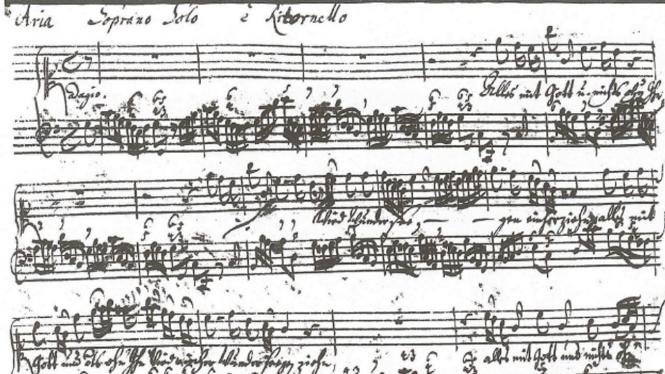 In manuscrit ord la plima da Johann Sebastian Bach.