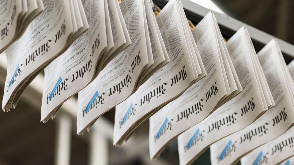 En la stamparia da la NZZ: Avant in onn era il gudogn bun il dubel uschè gronds. 