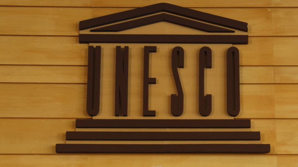 Il logo da l'UNESCO sin ina parait da lain.