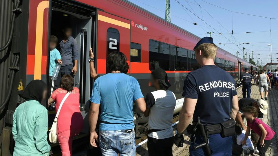 Fugitivs van a bord d'in tren.