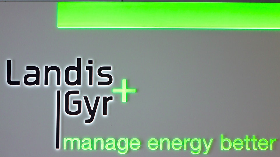 Purtret dal logo da «Landis und Gyr». 