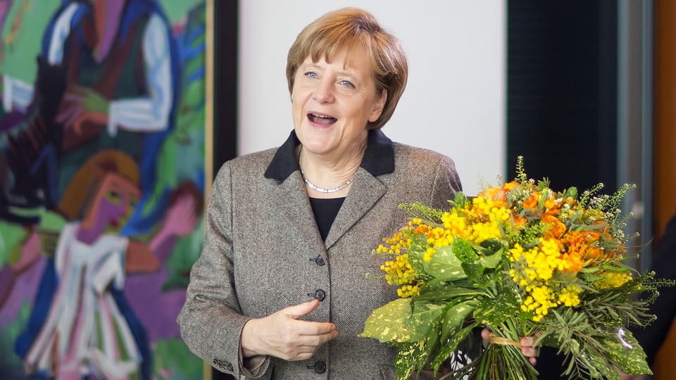 Angela Merkel cun in matg fluras.