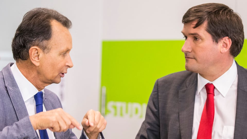 Philipp Müller da la PLD e Christian Levrat da la PS a chaschun da las davosas votaziuns ils 14 da zercladur.