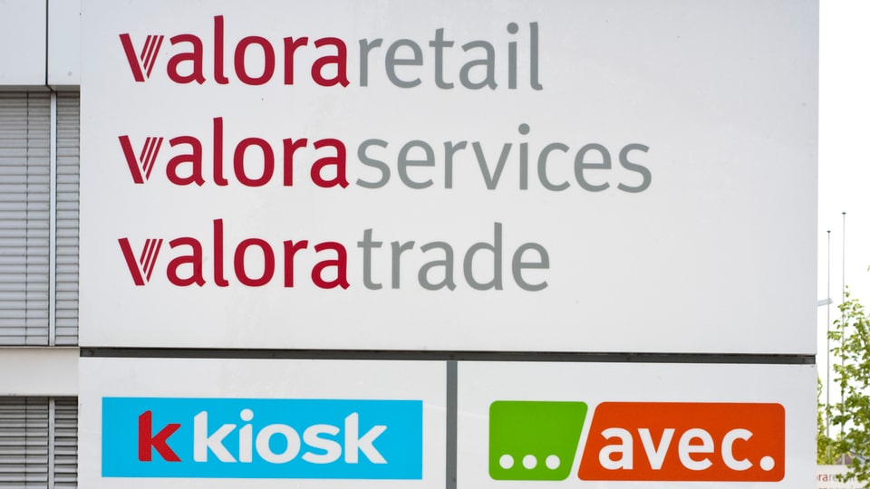 Purtret dal logo da Valora. 