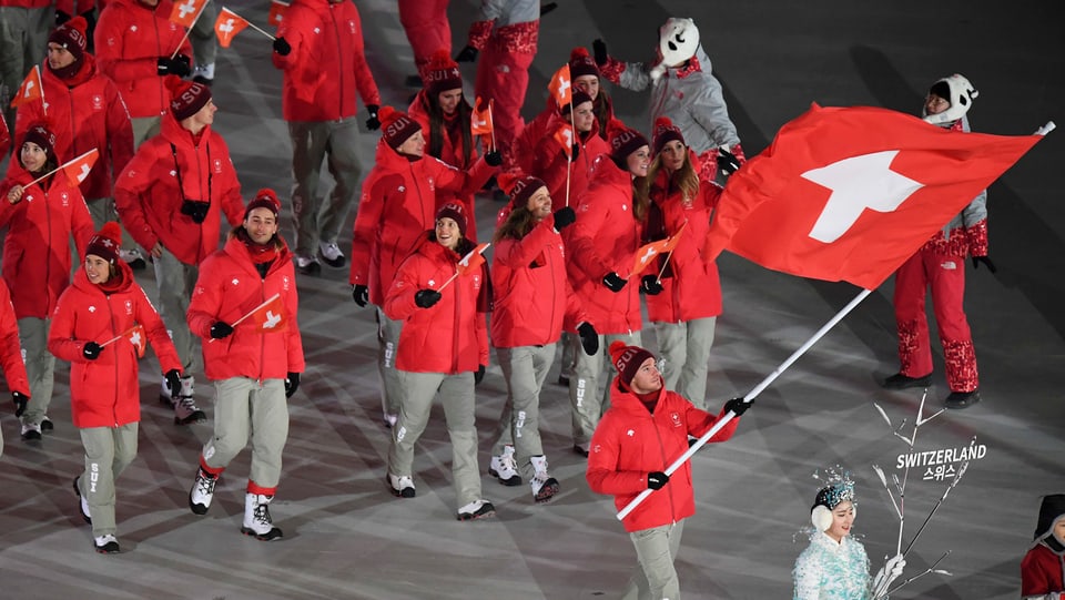 Purtret da Dario Cologna e la delegaziun davos el. 