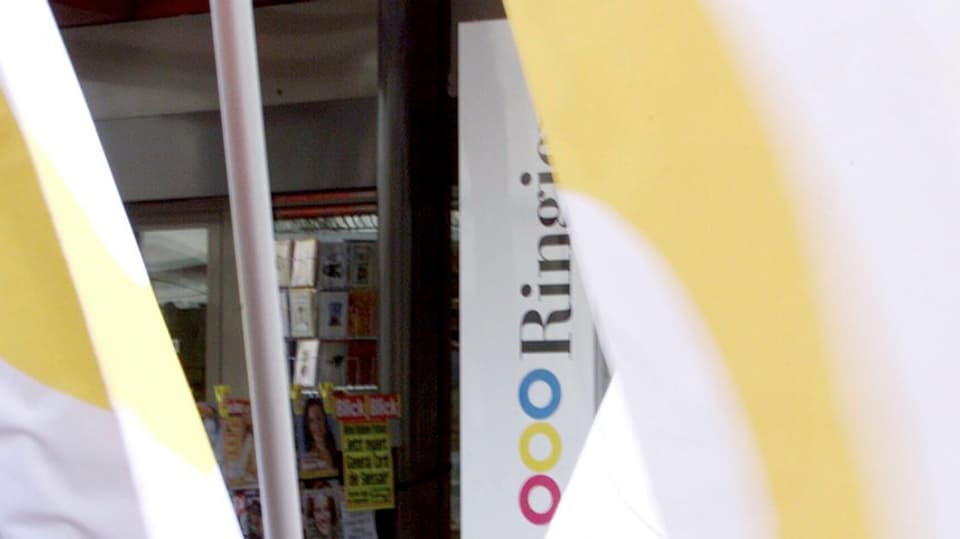 Il logo da Ringier, davon bandieras.
