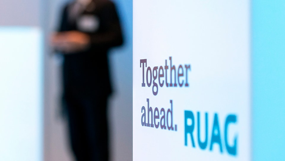 Purtret dal logo da la Ruag. 