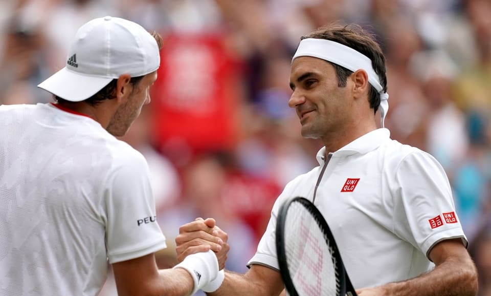 Lucas Pouille e Roger Federer. 