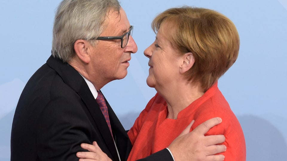 Juncker e Merkel.